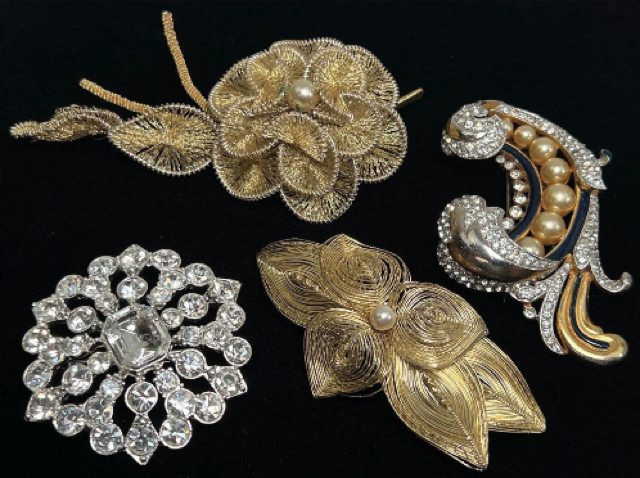 Gold and silver brooches